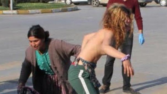 Polisleri görünce bir anda soyunmaya başladı...