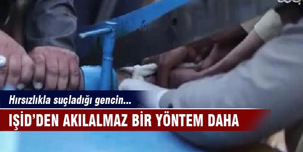 IŞİD, hırsızlıkla suçladığı gencin elini kağıt giyotiniyle kesti