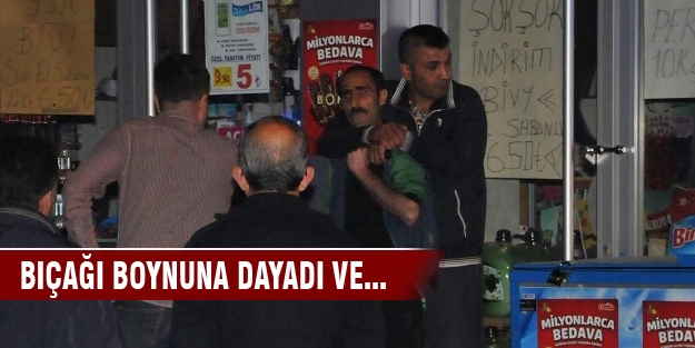 Sokak ortasında boynuna bıçak dayayıp rehin aldı