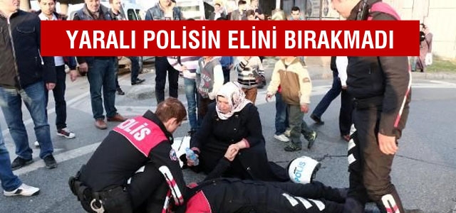 Yaralı polisin başında bekledi